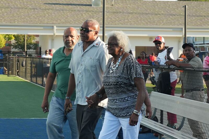Family of J.O. Brown walk to 50 yard line.