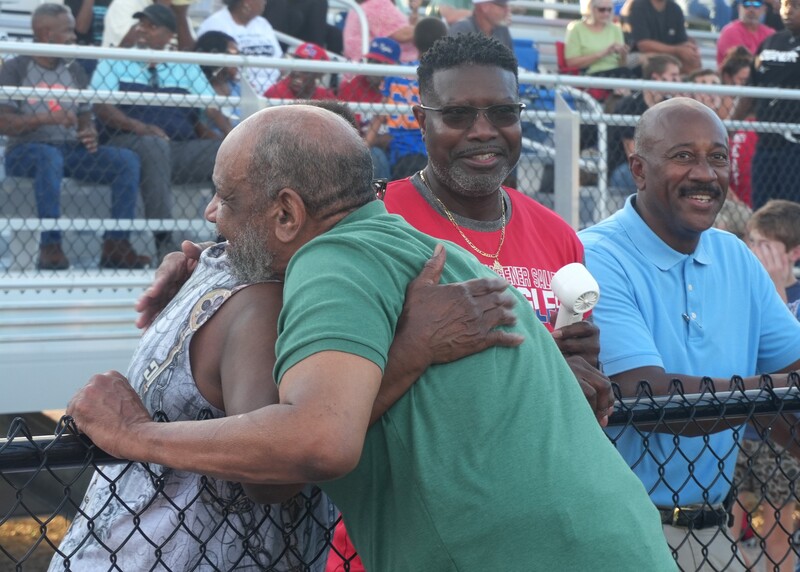 Family of J.O. Brown hug.