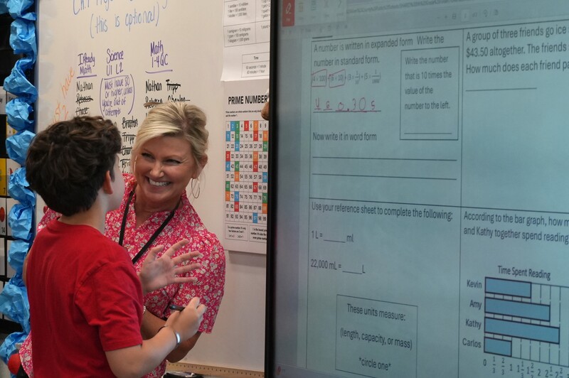 Hammond Hill Elementary teacher Amy Hadden helps a student in her class.
