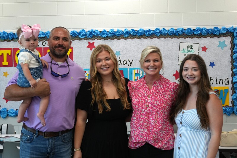 Amy Hadden smiles with her family.