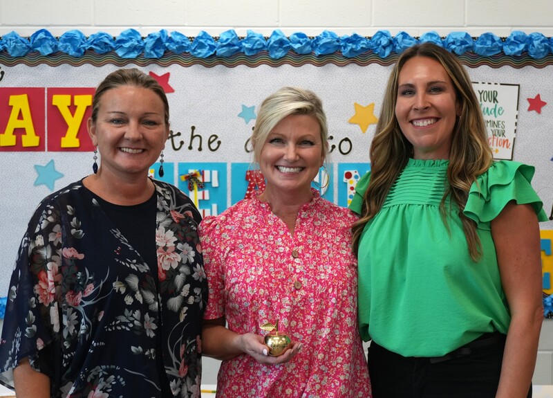 Amy Hadden smiles alongside Hammond Hill administration.