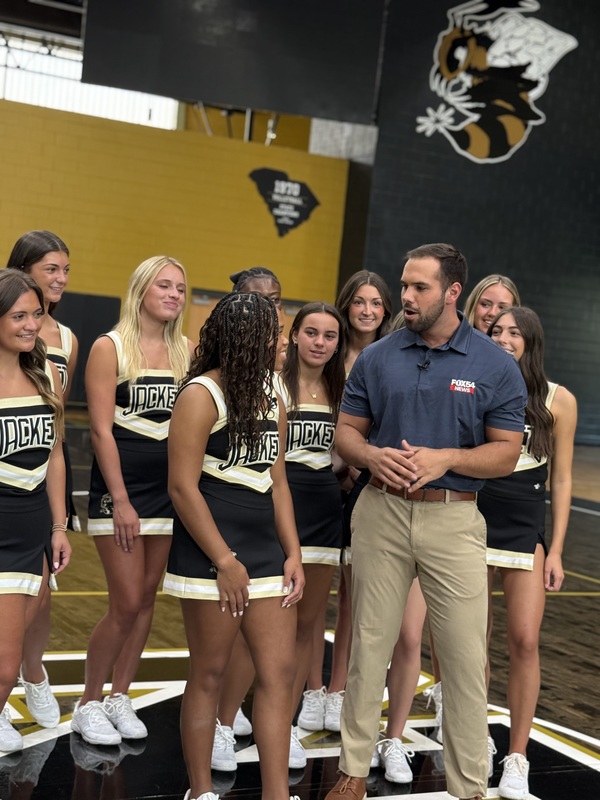 North Augusta High Cheerleaders interviewed by reporter with Fox54.
