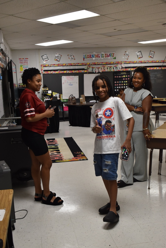 Families talking with teachers.