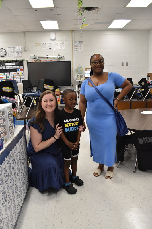 Families talking with teachers.