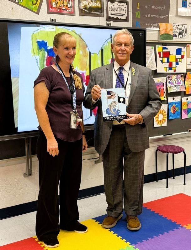 Congressman Joe Wilson visits North Augusta Elementary and receives painting from art teacher.