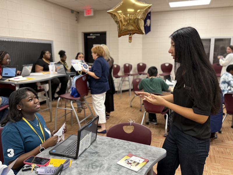 College representative talks with high schools student.