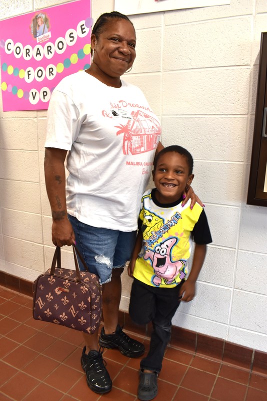 Grandparents and families at lunch with students.