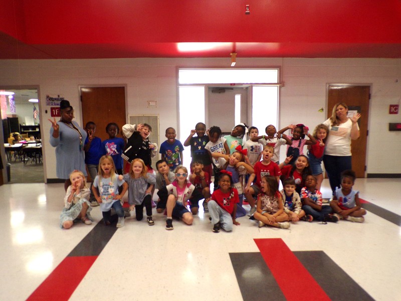 Students and staff wearing red, white, and blue.