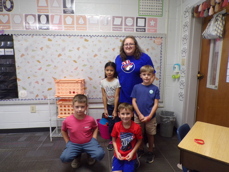 Students and staff wearing red, white, and blue.