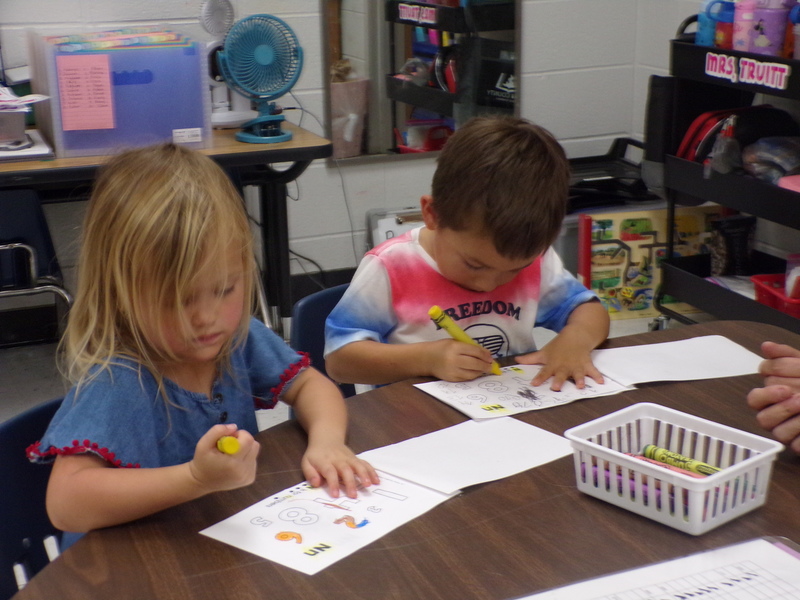 Students woking at a table.