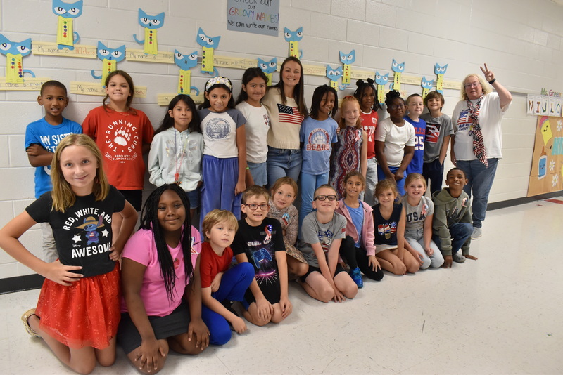 Students and staff wearing red, white, and blue.