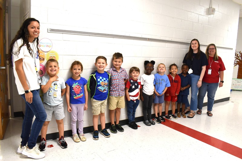 Students and staff wearing red, white, and blue.