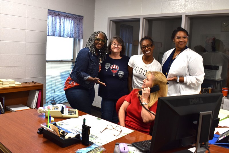Staff wearing red, white, and blue.
