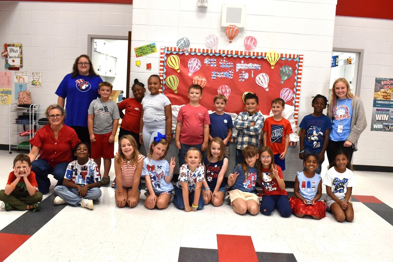 Students and staff wearing red, white, and blue.