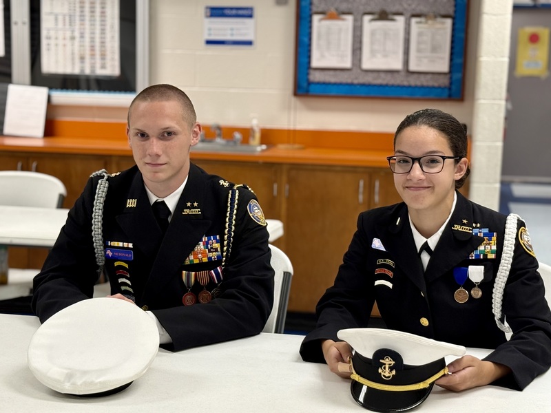 Two MVHS NJROTC cadets in uniform in class.