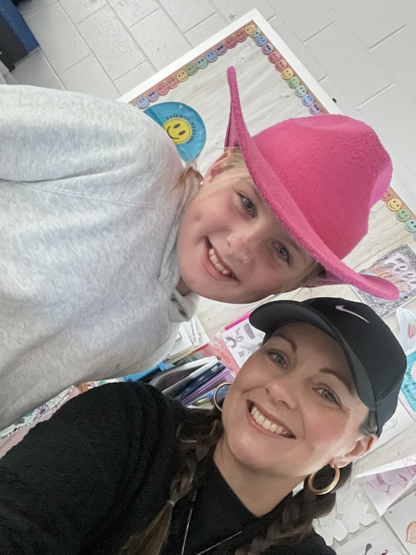 Student and staff wearing hat.