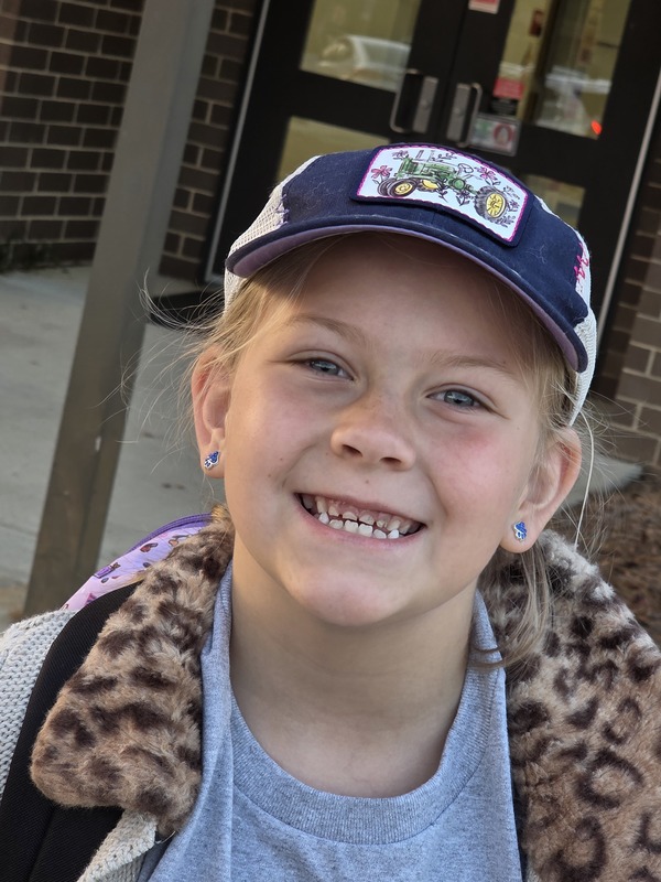 Student wearing hat.