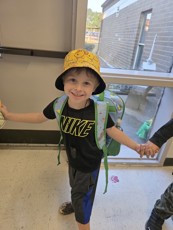 Student wearing hat.