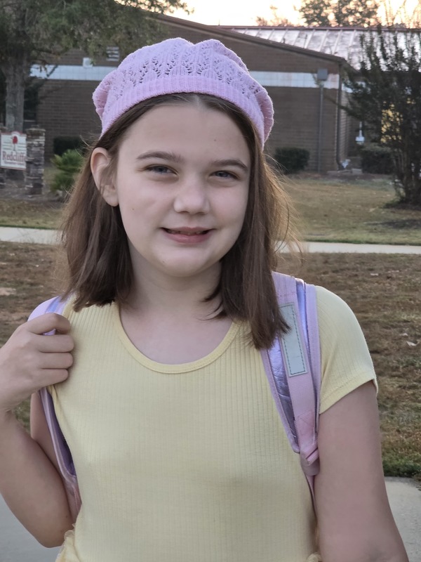 Student wearing hat.