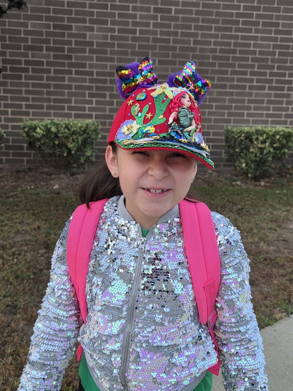 Student wearing hat.