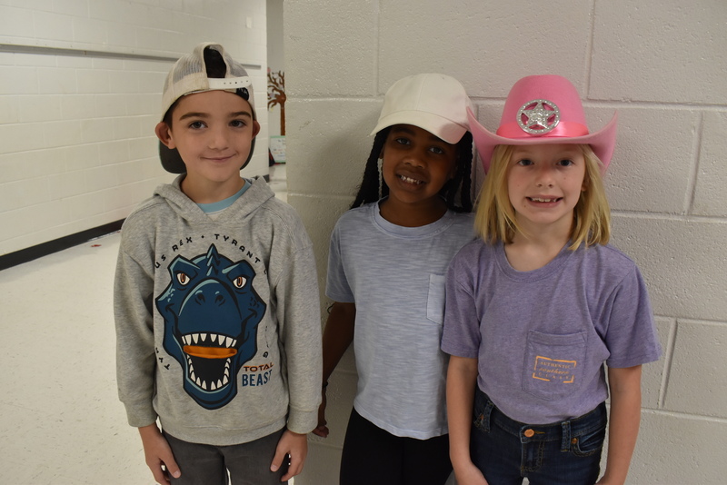 Students wearing hats.