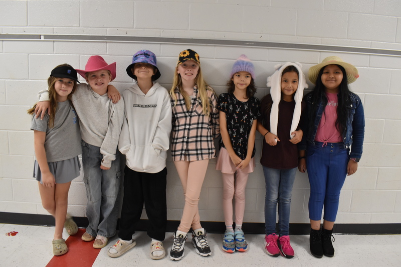 Students wearing hats.