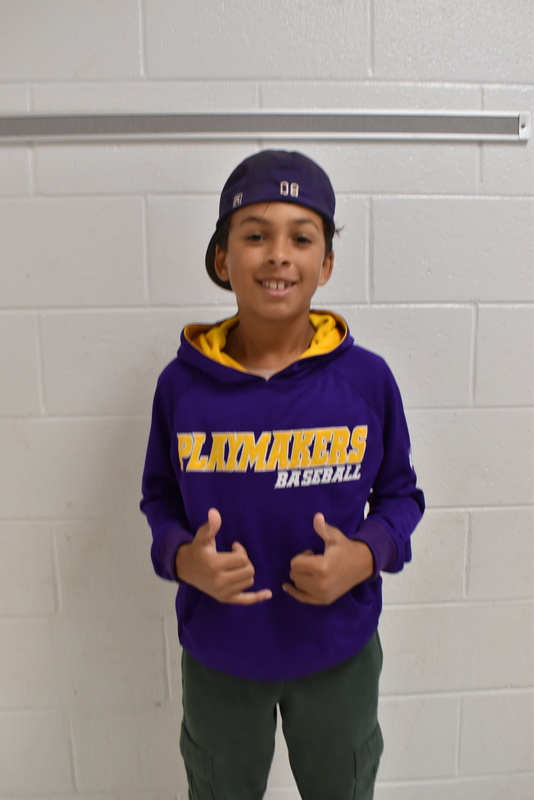 Student wearing hat.