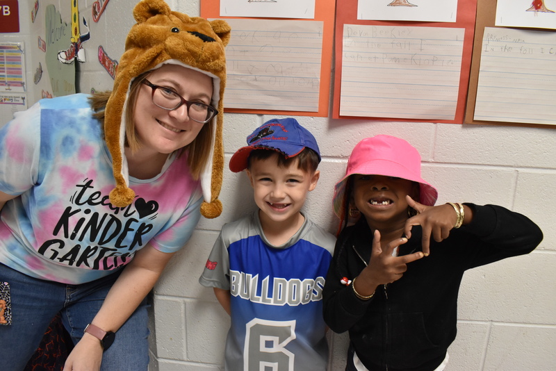 Students and staff wearing hats.