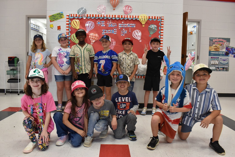 Students wearing hats.