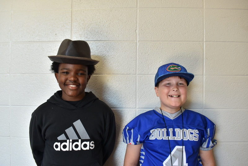 Students wearing hats.
