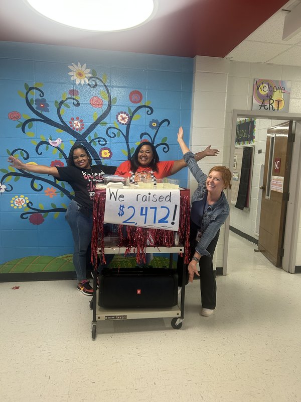 Staff celebrating donations.