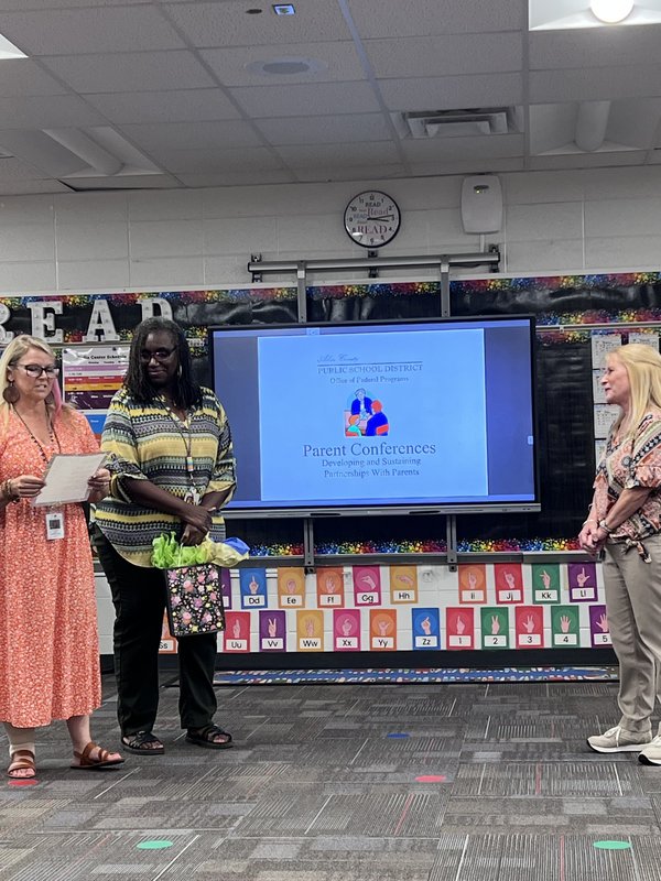 Three women talking.