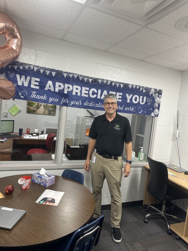 Man standing in office.