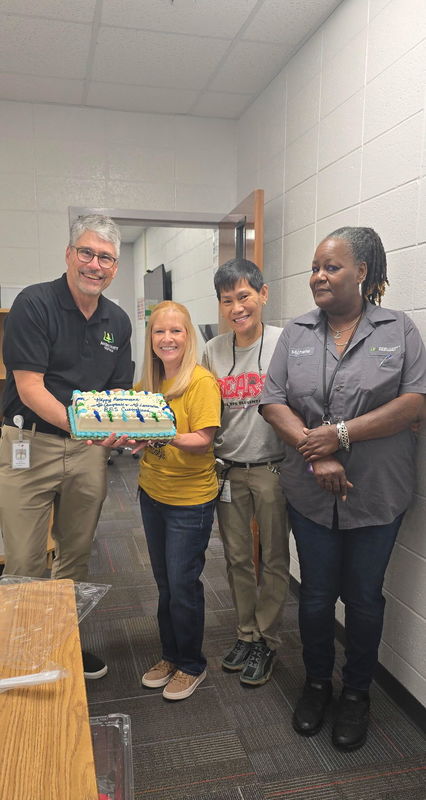 People holding cake.