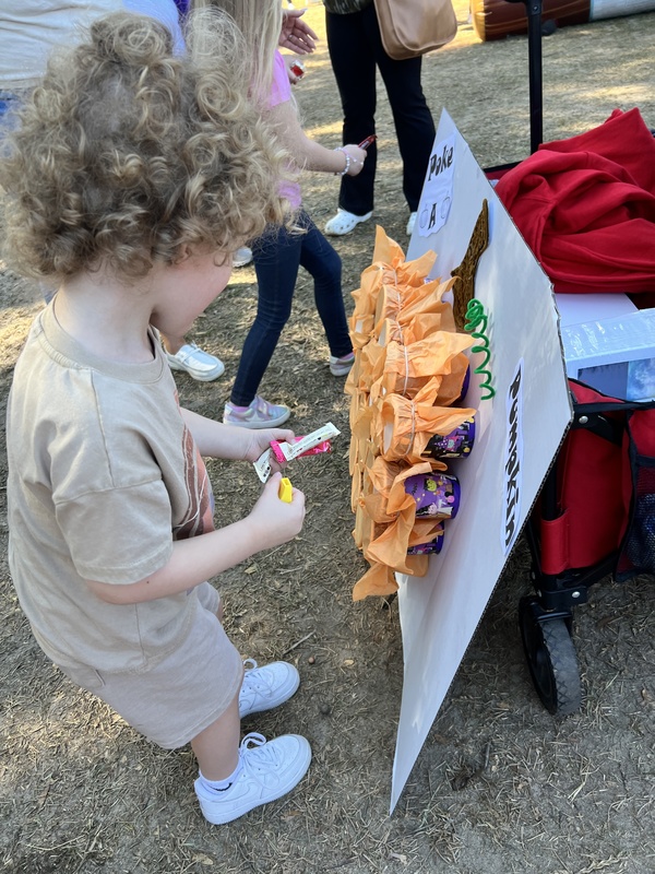 Student at Hook n Cook festival playing a game.