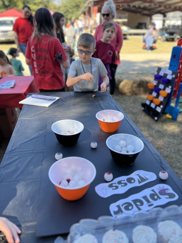 Student playing game at Hook n Cook festival.
