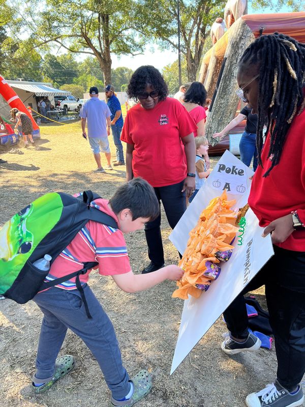 Student playing game at Hook n Cook festival.