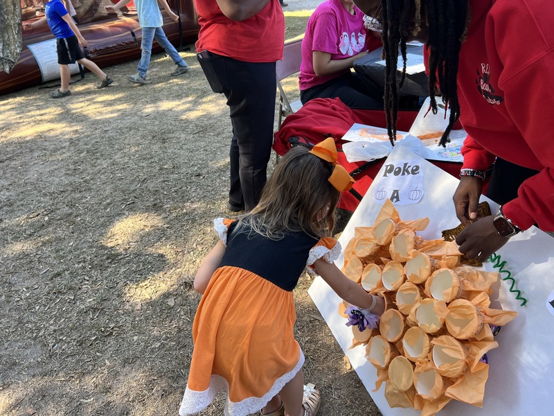 Student playing game at Hook n Cook.