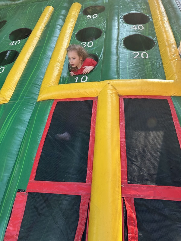 Student in inflatable game.