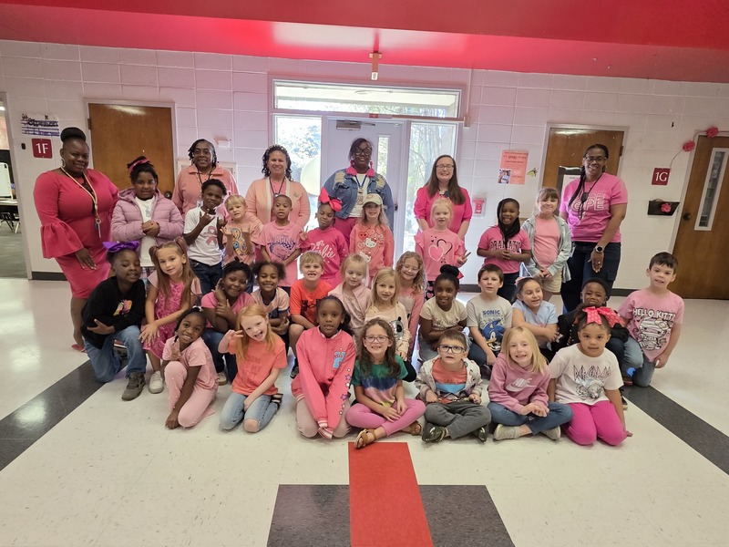 Group of students and staff wearing pink.Group of students and staff wearing pink.