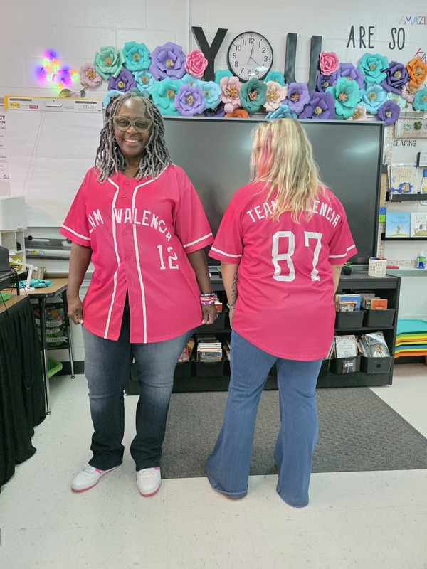 Two teachers wearing pink