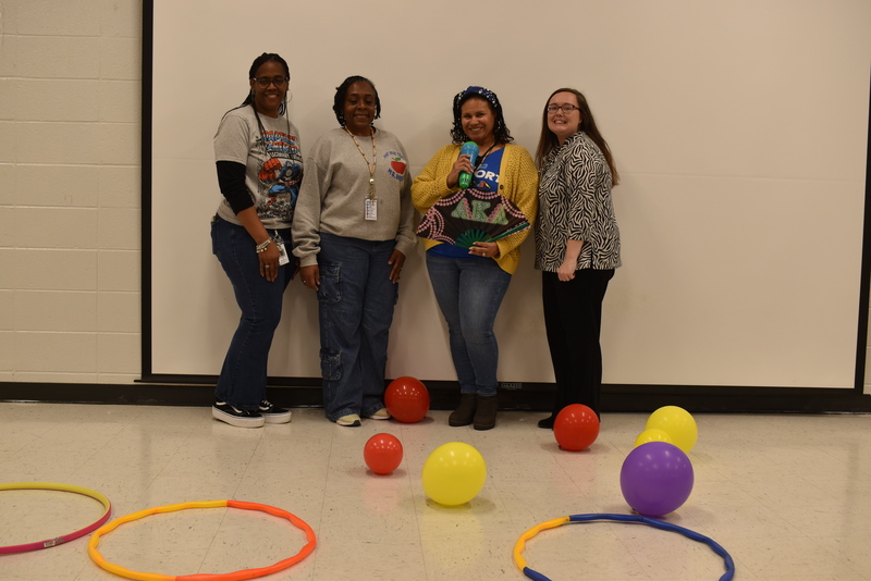 Four staff at ring toss.