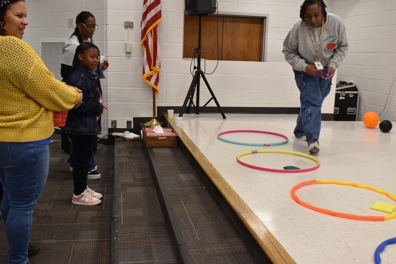Students playing carnival game.