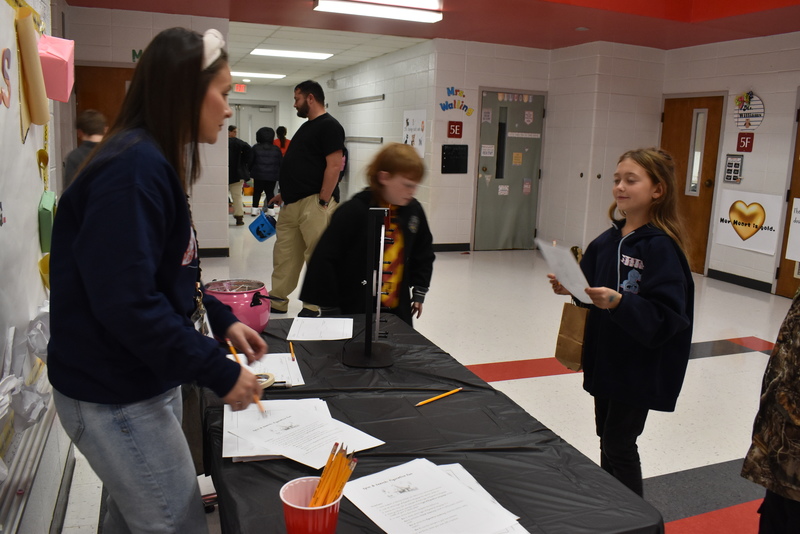 Students playing carnival game.