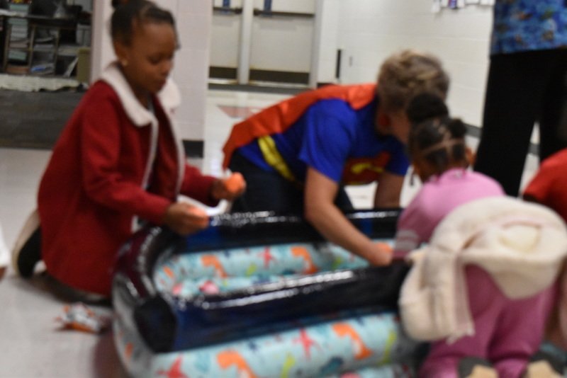 Students playing carnival game.