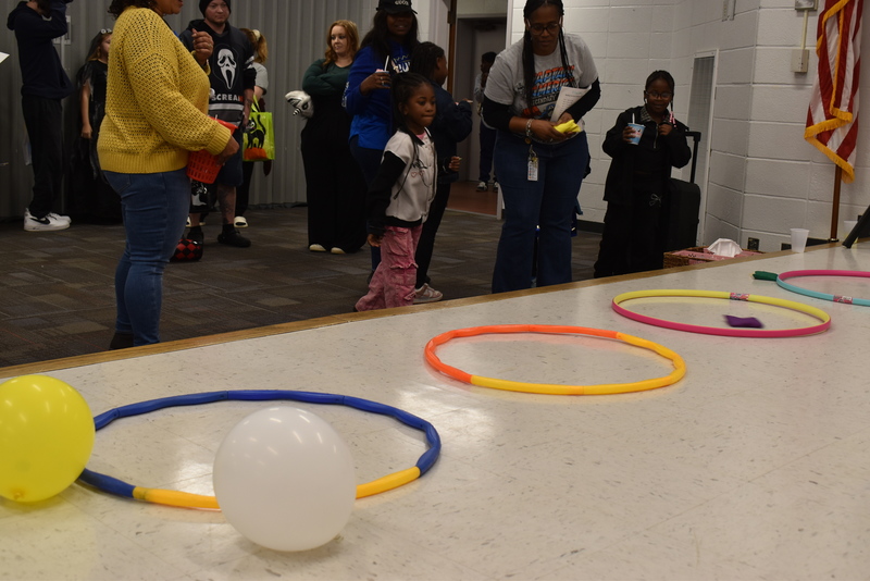 Students playing carnival game.
