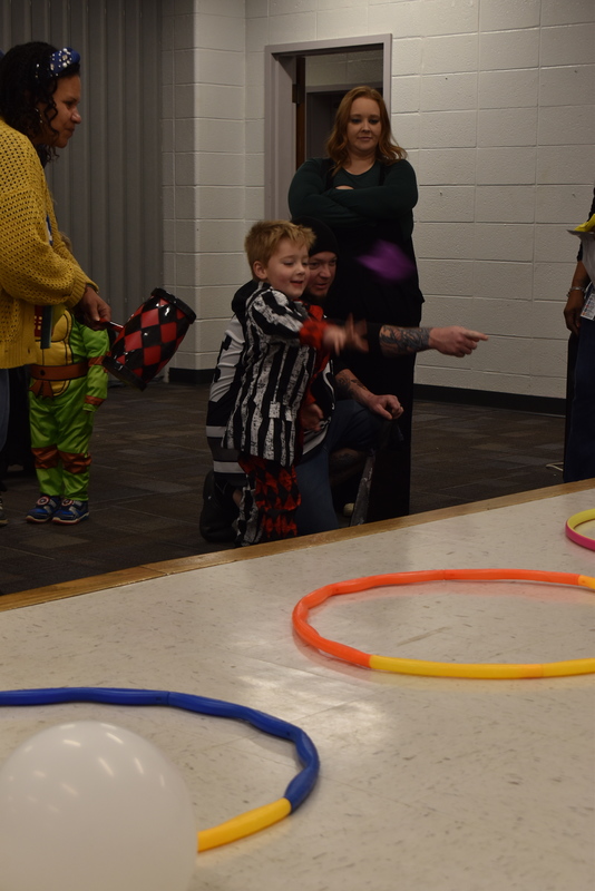 Students playing carnival game.
