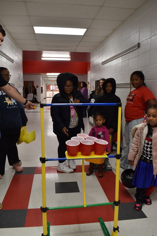 Students playing carnival game.