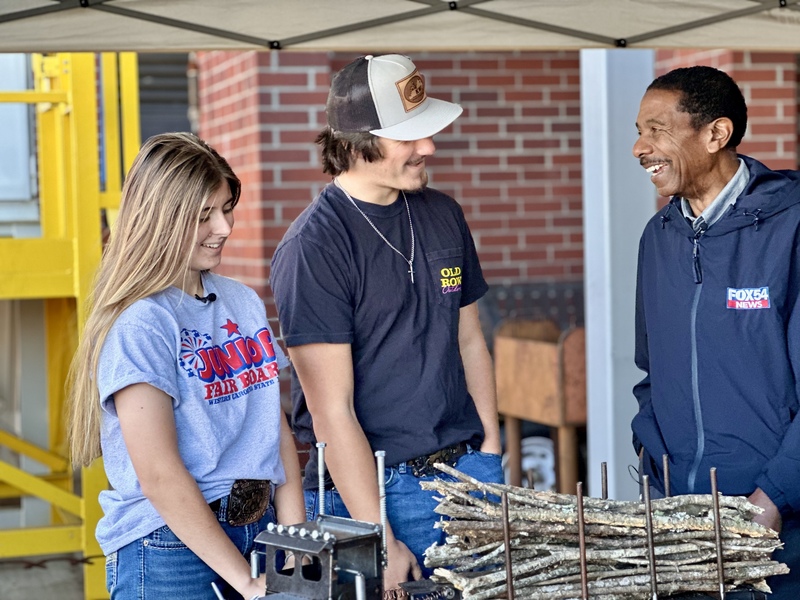 Two WSHS welding students being interviewed by Jay Jeffries with FOX 54 News.
