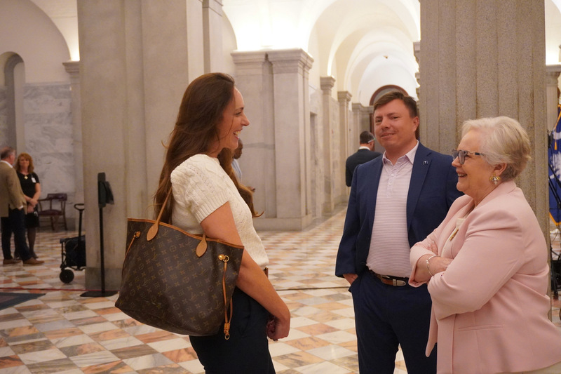 ACPSD Communication Direct and Board Member conversing before Blue Ribbon ceremony.
